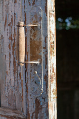 Rustic door knob on the old wooden door