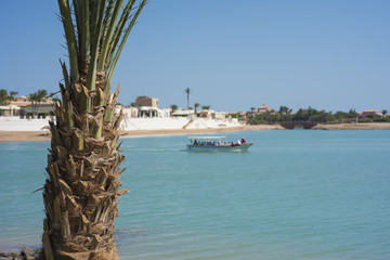 Water taxi traveling on a tropical lagoon.