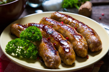 Fried sausages with parsley and brussels sprouts