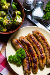 Fried sausages with parsley and brussels sprouts