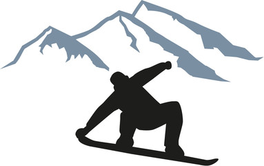 Snowboarder jumping in front of mountain silhouette