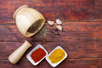 Spices powder on wooden board, close-up. Spices on table  