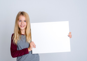 nice blond girl showing a white sign