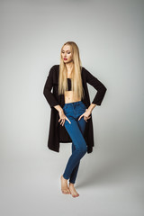 Beautiful Stylish Girl in Fashion Denim Jeans Posing