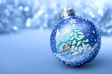 Fototapeta na wymiar Christmas ball blue and white on blurred background new year