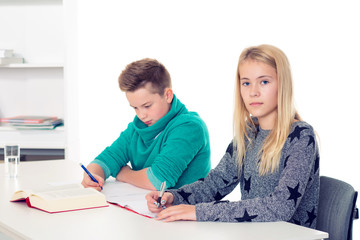 girl and boy together in the classroom