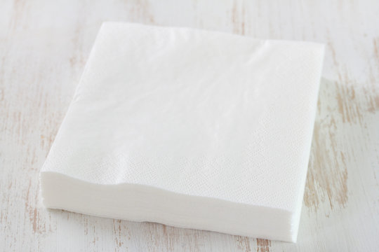 paper napkin on white wooden background