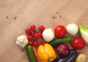 Pile of organic vegetables on a wooden table