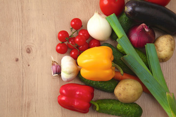 Pile of organic vegetables on a wooden table