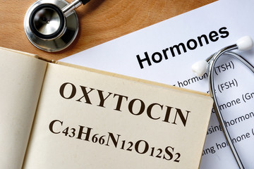 Oxytocin  word written on the book and hormones list. - obrazy, fototapety, plakaty