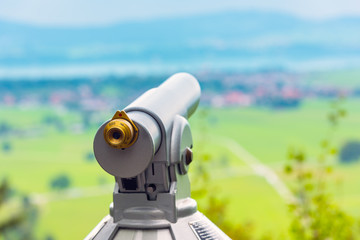 Image of a telescope overlooking for rural landscape