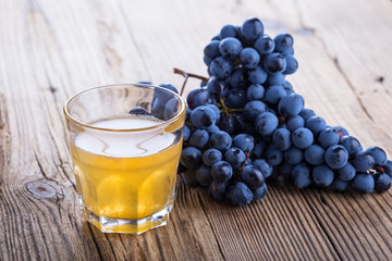 Black grapes and freshly squeezed grape juice