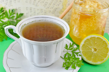 Hot tea with parsley, lemon and honey