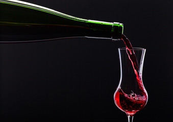 bottle and glass with alcoholic drink