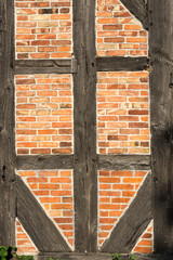 red brick wall with wooden beams