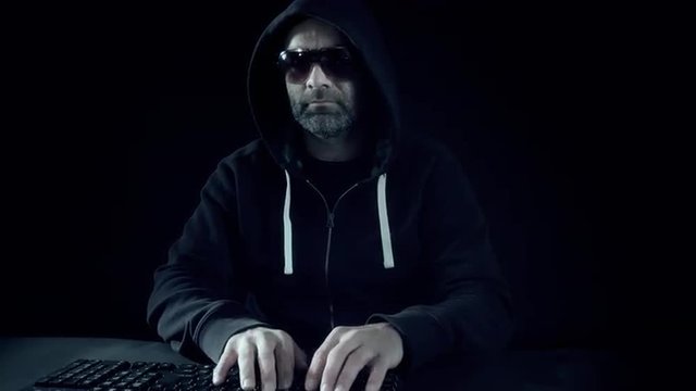 Man hacker hacking bank computer