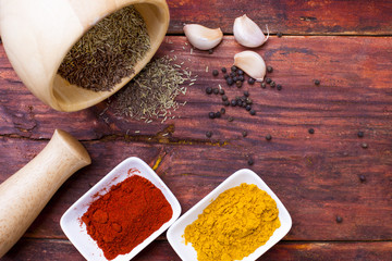 Spices powder on wooden board, close-up. Spices on table  