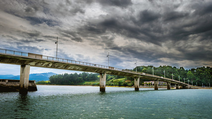 Bridge under a cloudy sky
