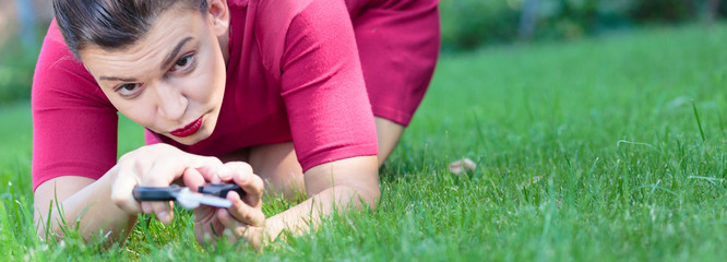 Cutting grass with scissors