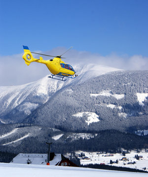 Rescue helicopter in the mountains