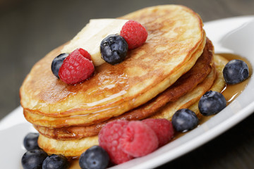 Pancakes with raspberry, blueberry and maple syrup