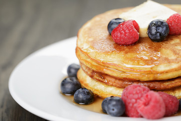 Pancakes with raspberry, blueberry and maple syrup