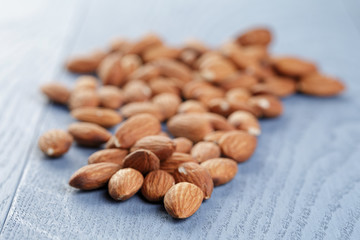 roasted almonds on blue wooden table