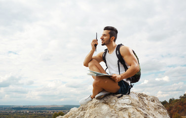 Young man tourist with a backpack
