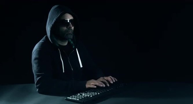 Internet hacker typing on keyboard, shot in raw 4k