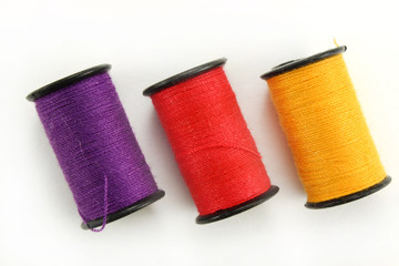 Threads for sewing on a white background