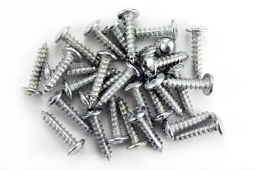 Screws for fastening on a white background