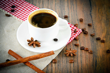 Cup of Coffee on Woody Background