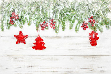 Christmas tree with red decoration and falling snow