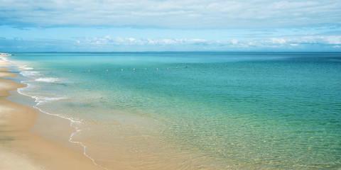 View from Tangalooma Island beach during the day with an overcast sky
