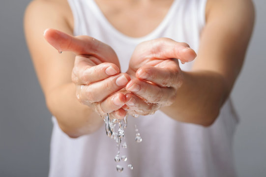 Water from woman hand