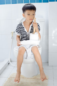 Boy using toilet