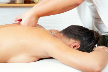 Fototapeta na wymiar Young women getting back massage in massage salon