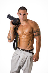 Shirtless young man with professional photo camera