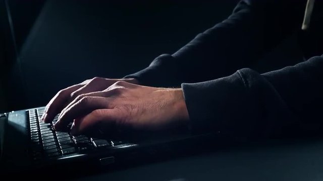 Man's hands typing on keyboard 4K