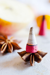traditional Czech christmas - smoking incense cones on star anise spice with whole cinnamon and apple