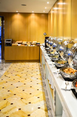 Banquet meals served on tables, food for group in restaurant.