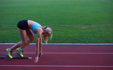 pixelated design of woman  sprinter leaving starting blocks