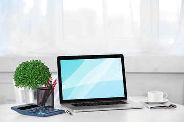 Fototapeta premium Modern workplace with laptop, close up