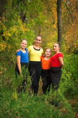 Fototapeta premium Young Girl Friends in the Forest in Autumn