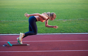 pixelated design of woman  sprinter leaving starting blocks