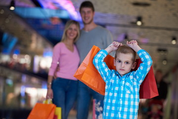 young family with shopping bags