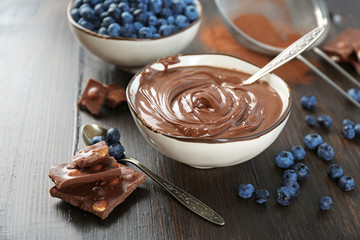 Beautiful composition with chocolate cream and blueberries