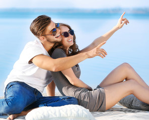 Young couple on the riverside