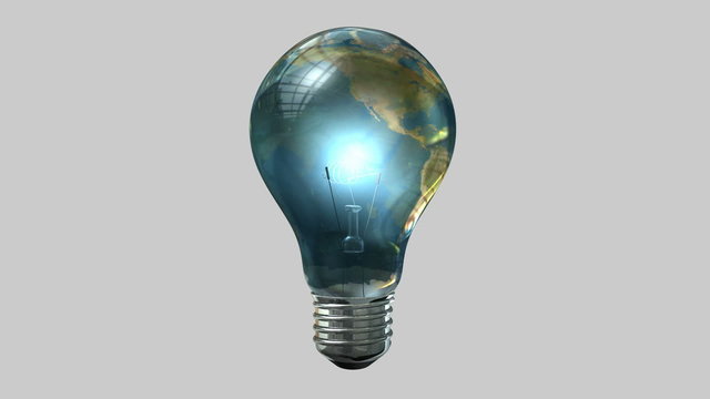 A regular lit light bulb with the glass wrapped in a world map rotating one full revolution on a white background