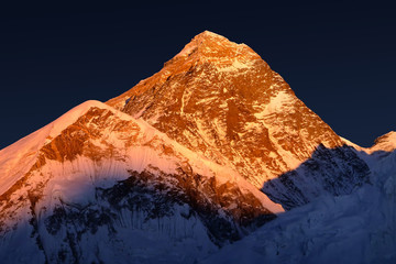 The peak of the highest mountain in the world - Mt. Everest at the sunset. - 94255651